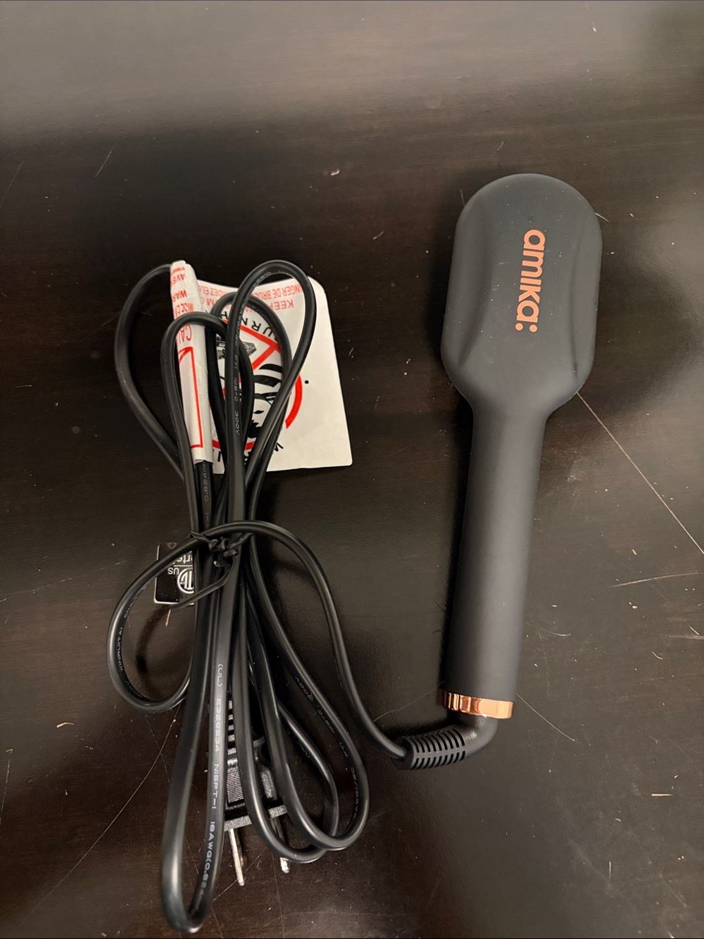 amika Black Heated Styling Brush with Rose Gold Accents